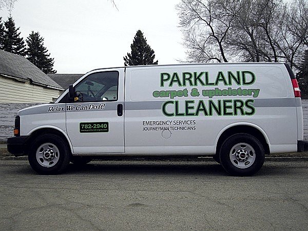 White Parkland Cleaners service van with green lettering